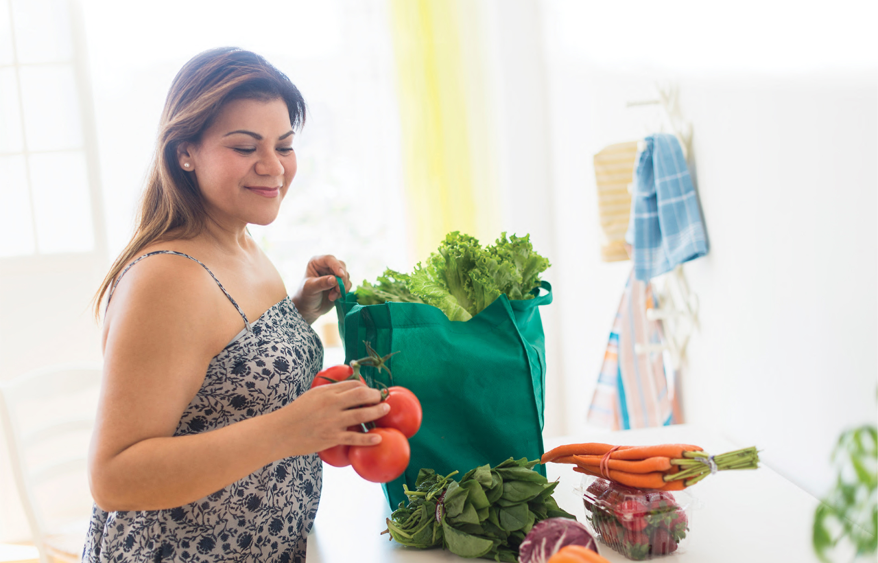 Woman unpacking her food shopping