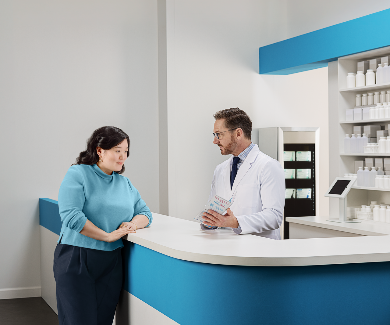 Woman talking to a pharmacist